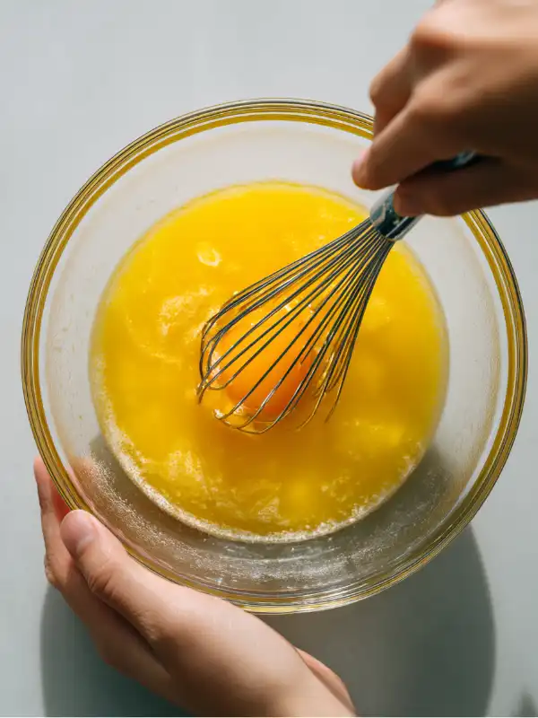 Mixing egg yolks, mustard, vinegar, sugar, and salt for Kewpie mayo