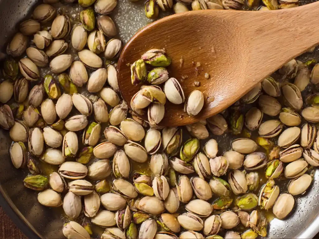 Shelled pistachios being softened in water before blending
