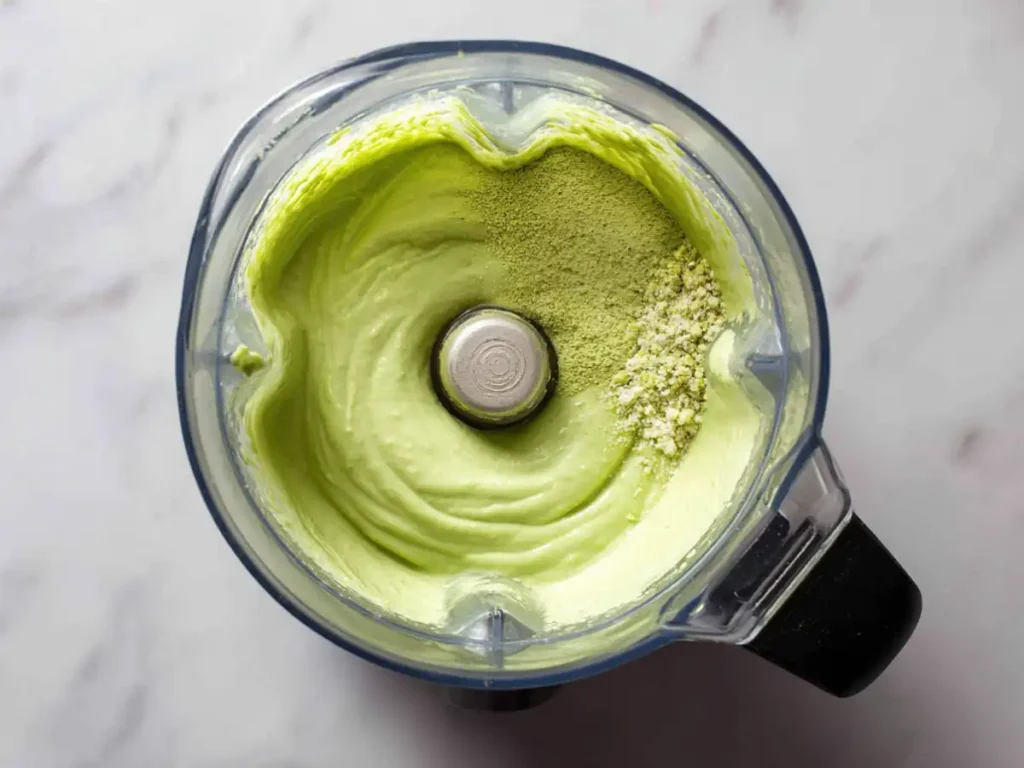 Smooth pistachio cream in a blender with added ingredients